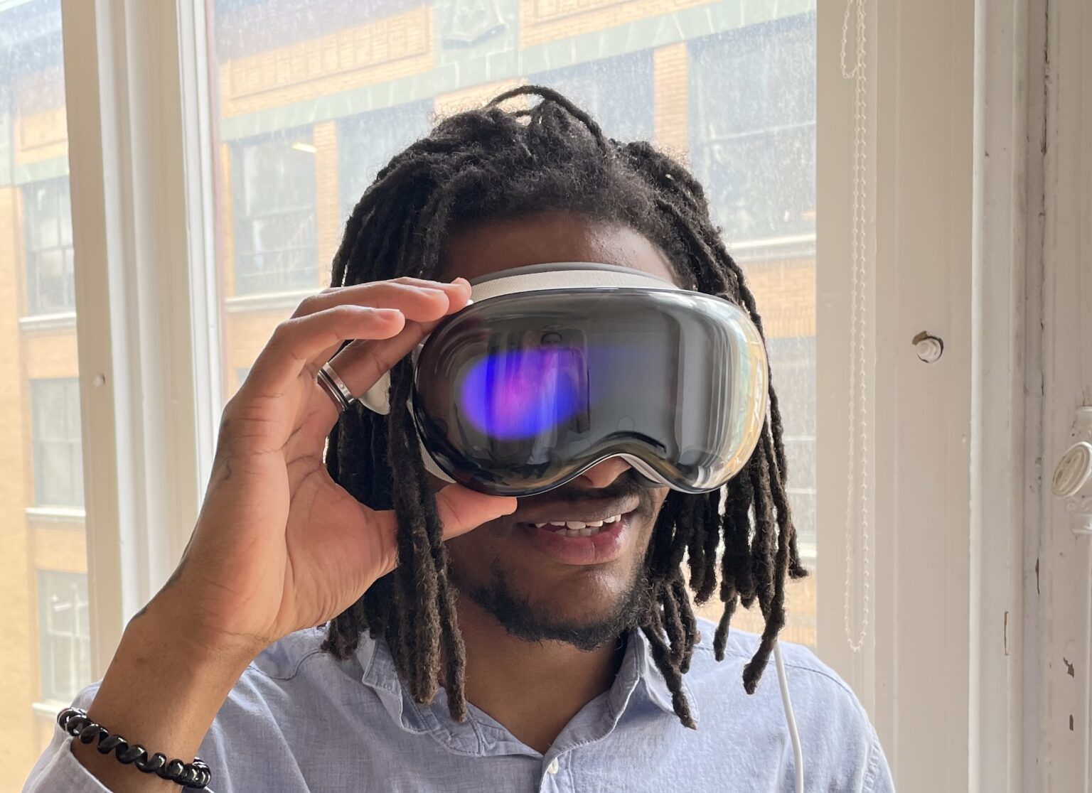 Man wearing Apple Vision Pro goggles