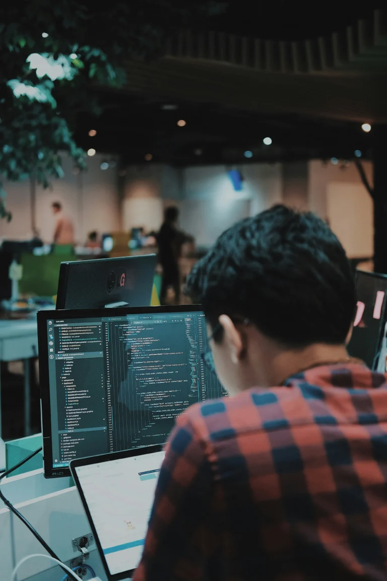 Developer reviewing mobile app code before an App Store submission