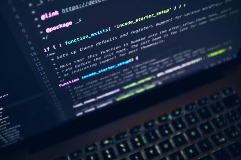 Close-up of code on a screen, representing the process of reviewing and fixing AI generated code before launch