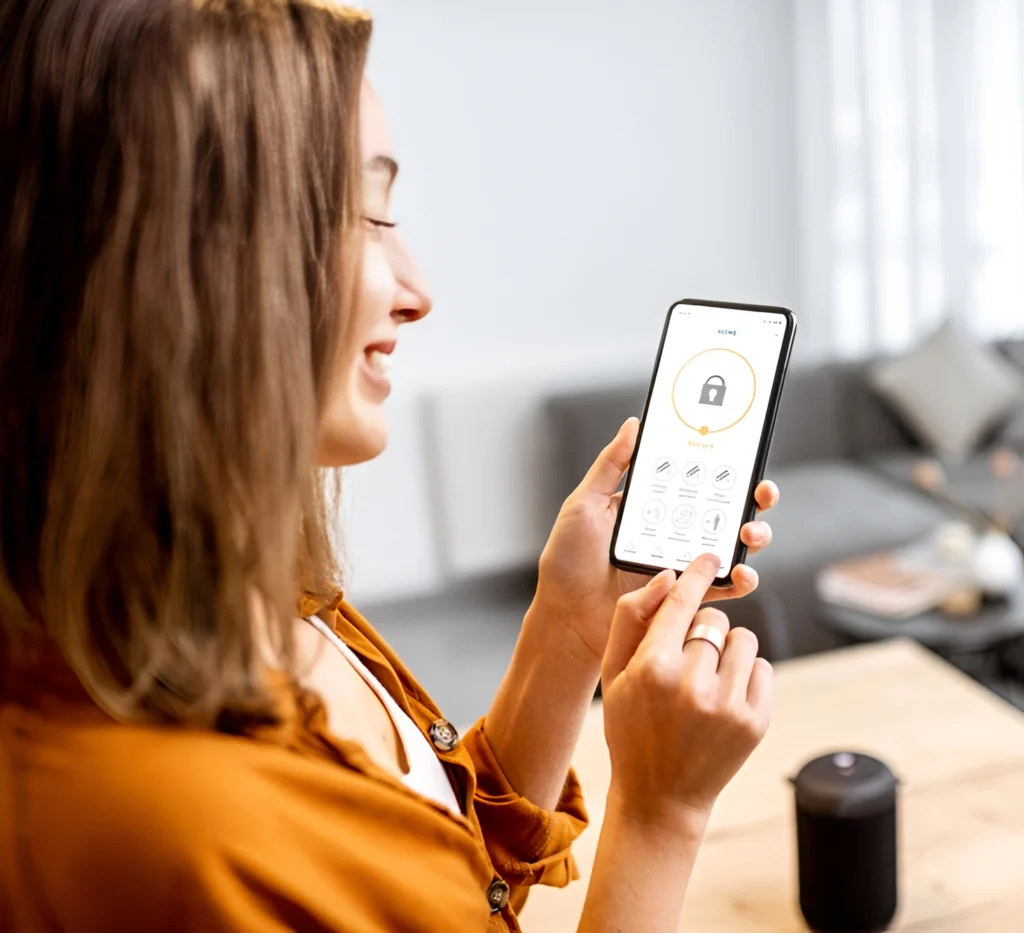 Woman holding a phone with a kotlin mobile app