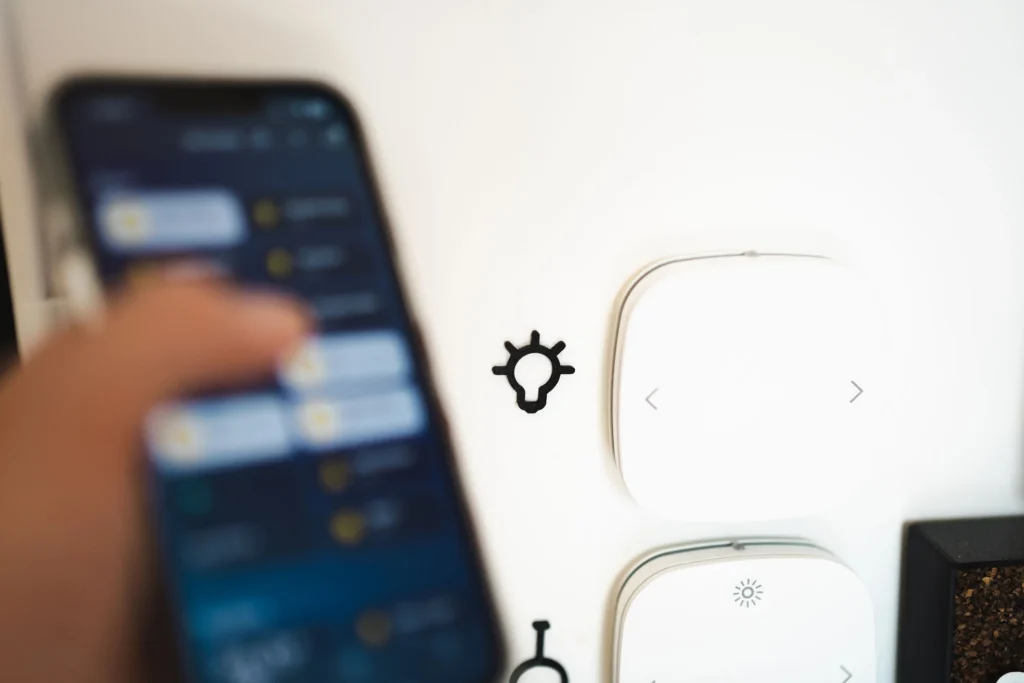 A phone's app remote controlling a light.