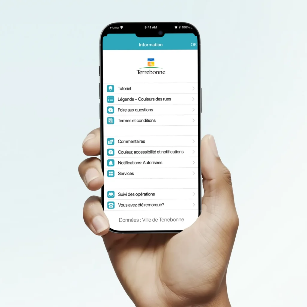 Hand holding a phone showing the Terrebonne parking app information menu with tutorial, street colour legend, FAQ, notifications and operation tracking